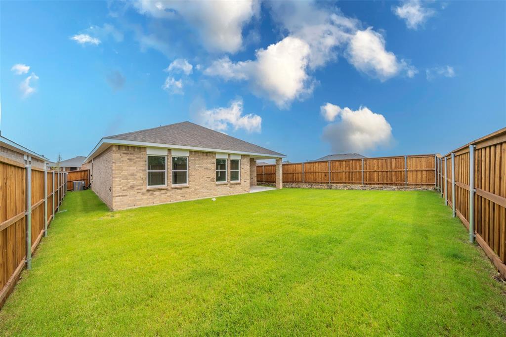 1838 Mccree Street Forney, TX 75126 - Photo 25 of 33 a view of an house with backyard and entertaining space