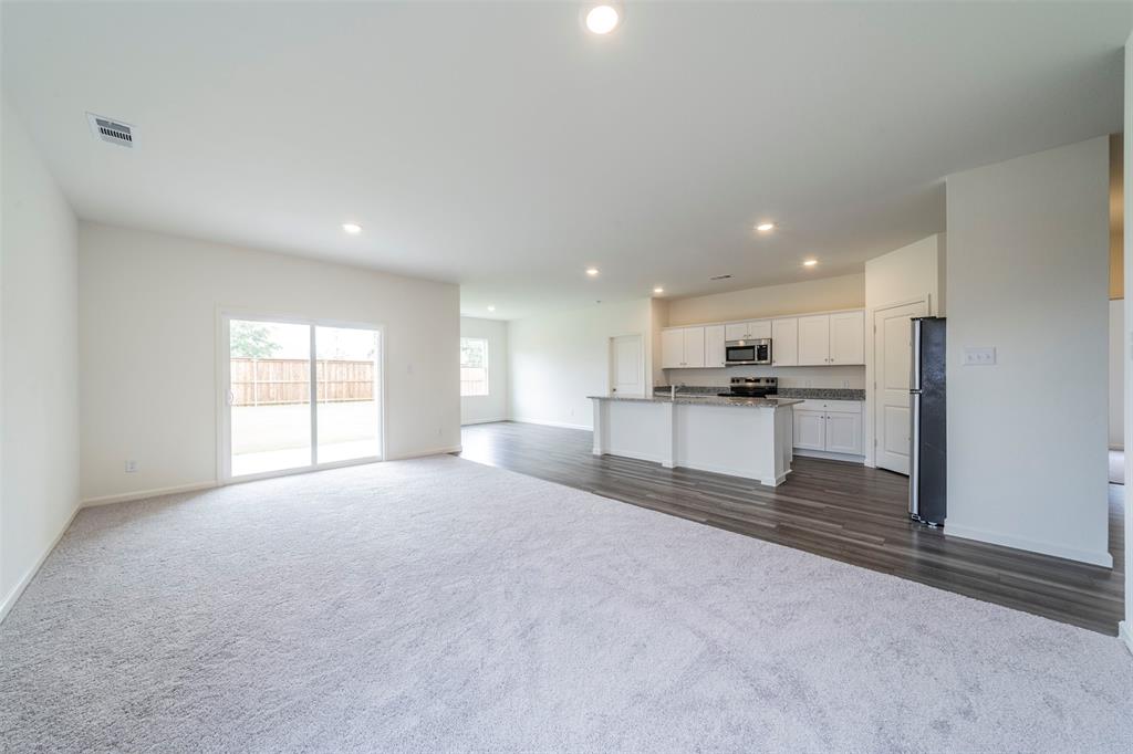 1838 Mccree Street Forney, TX 75126 - Photo 3 of 33 a big room with closet and windows