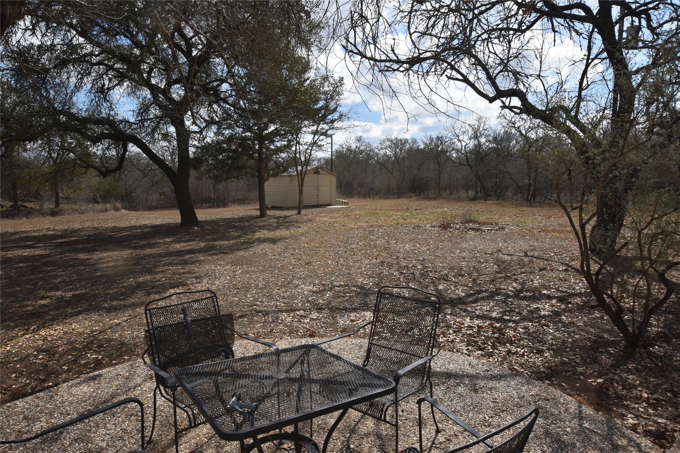 687 Fm 812 Road Red Rock, TX 78662 - Photo 24 of 40 View of yard featuring a storage shed