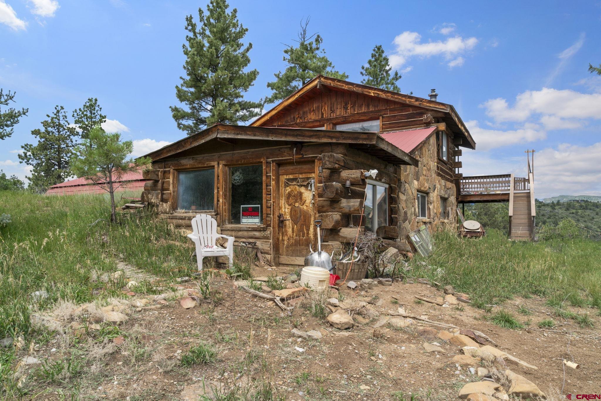 661 Ridge Road Durango, CO 81303 - Photo 13 of 17 a front view of a house with garden