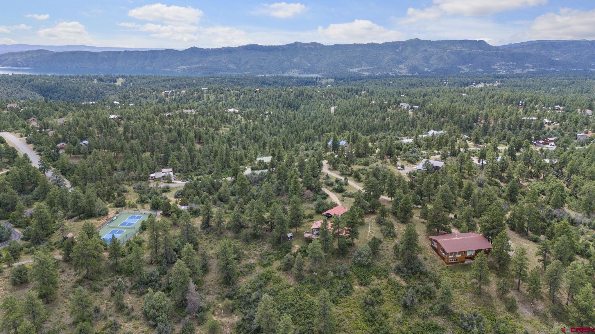661 Ridge Road Durango, CO 81303 - Photo 5 of 17 a view of a lush green hillside and a houses