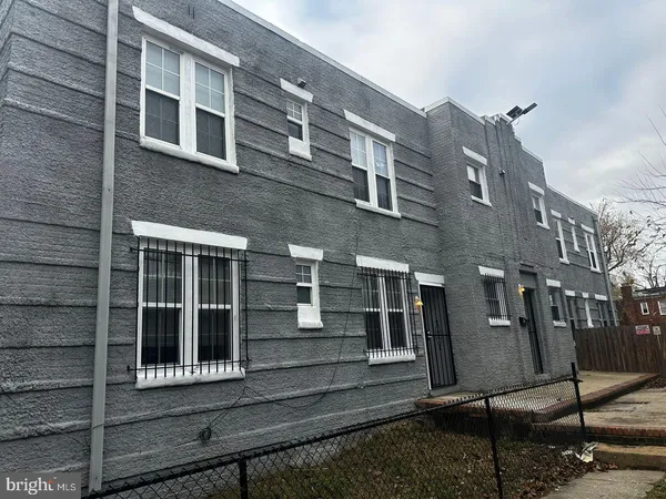 a view of a brick building with many windows