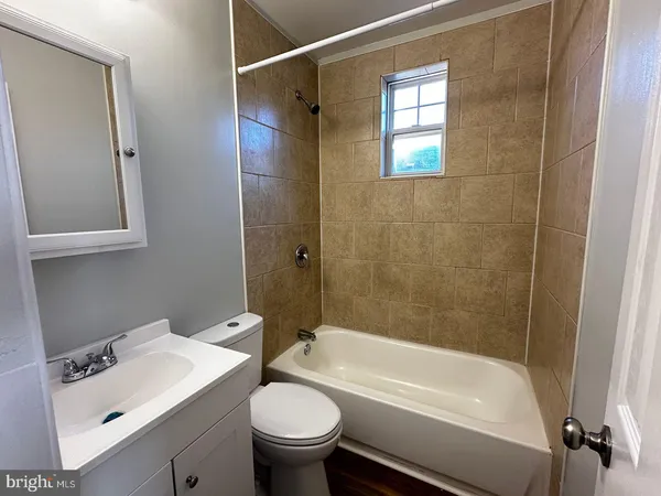 a bathroom with a sink and a bathtub