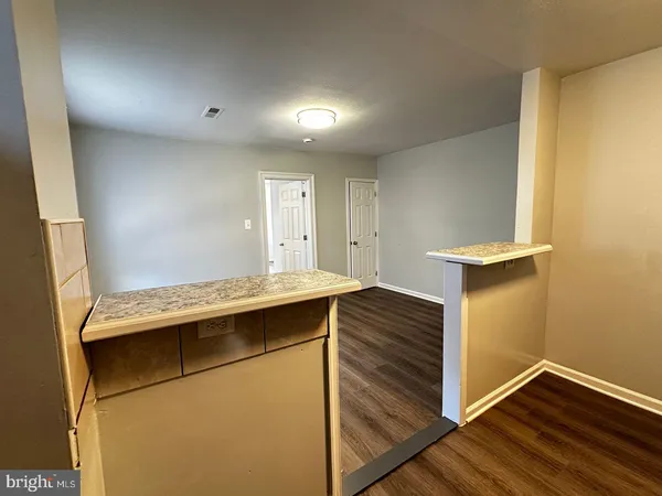 a kitchen with a stove and a refrigerator