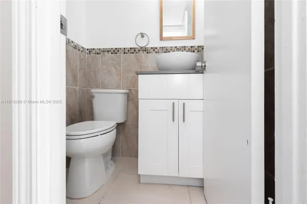 a bathroom with a toilet and a sink