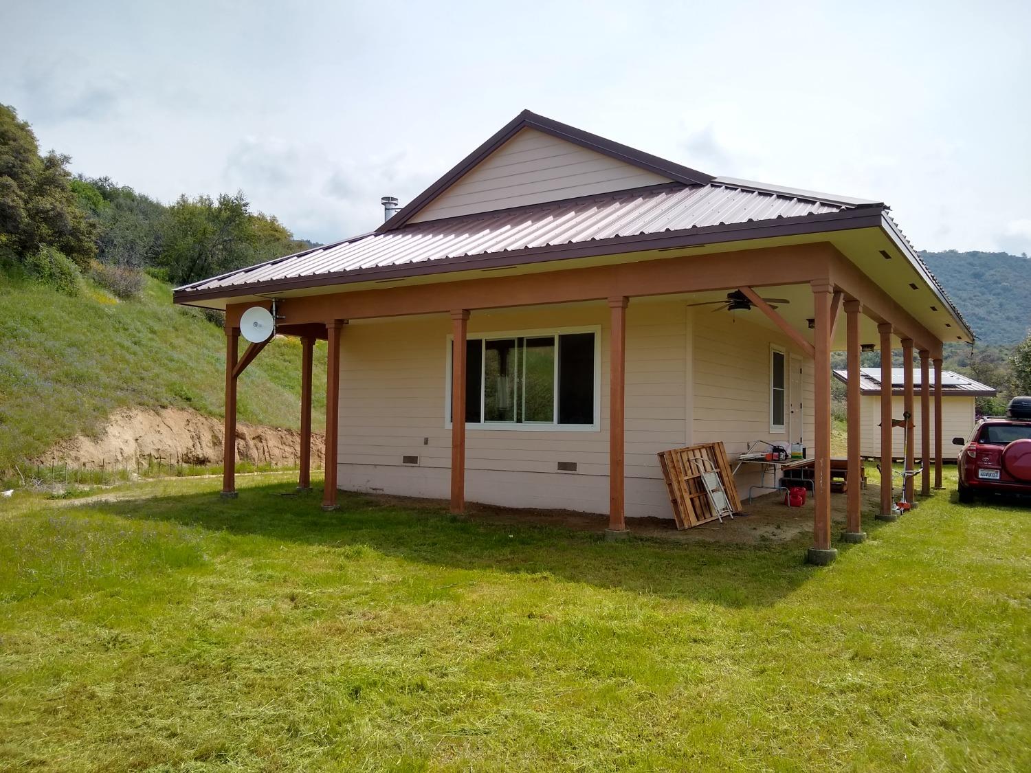 44981 Todd Eymann Road Dunlap, CA 93621 - Photo 24 of 95 a view of a house with backyard porch and furniture