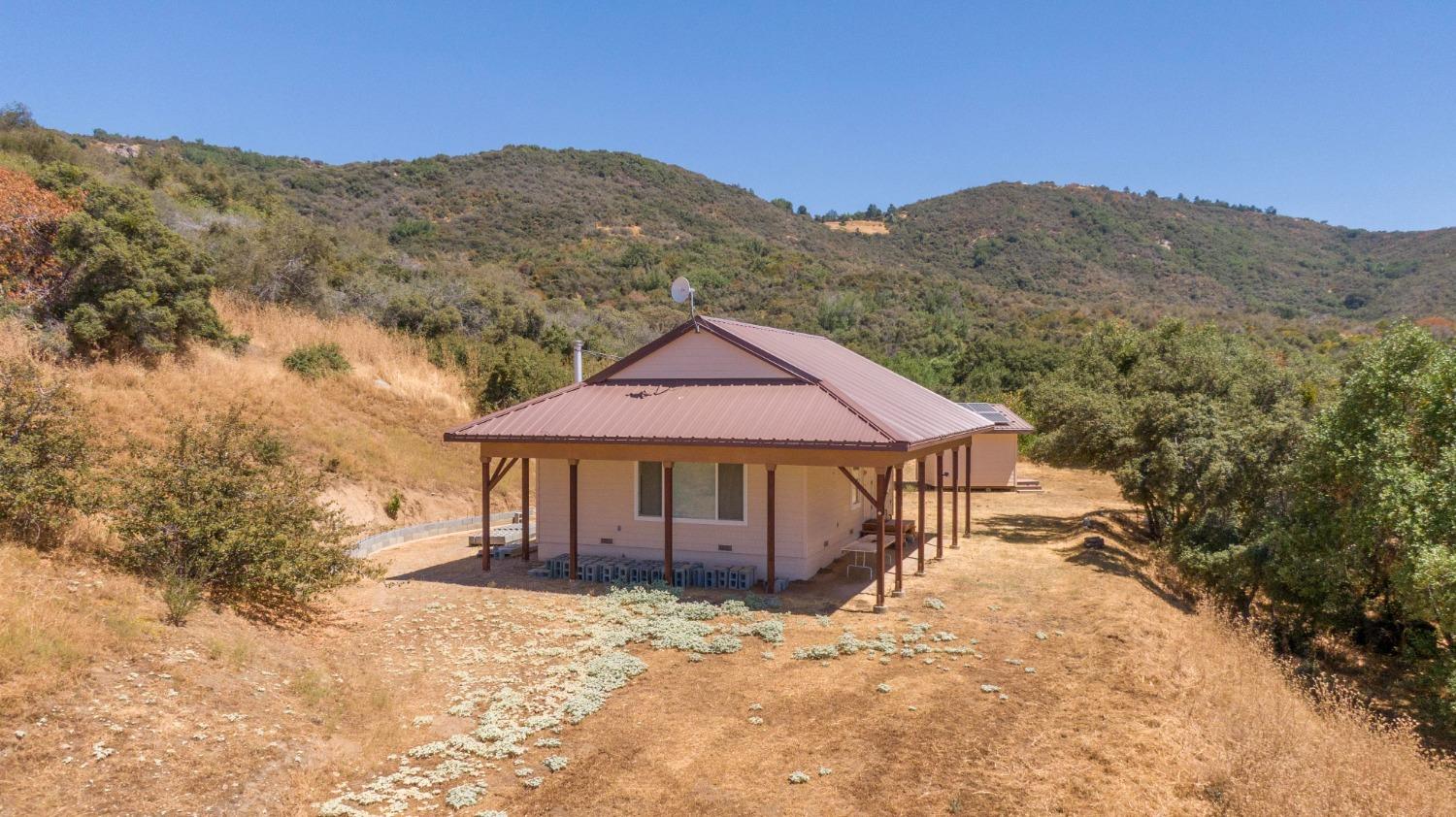 44981 Todd Eymann Road Dunlap, CA 93621 - Photo 37 of 95 a view of a house with a mountain yard