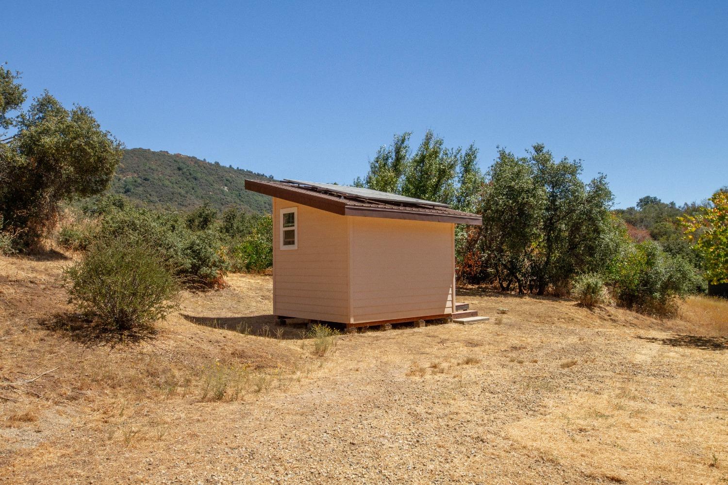 44981 Todd Eymann Road Dunlap, CA 93621 - Photo 45 of 95 a view of a dry yard with a house in the background