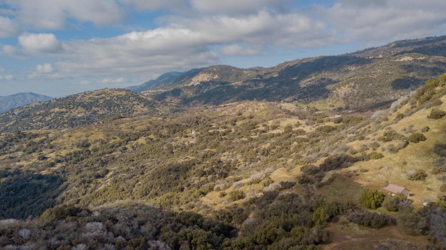 44981 Todd Eymann Road Dunlap, CA 93621 - Photo 60 of 95 a view of a dry yard with mountains in the background