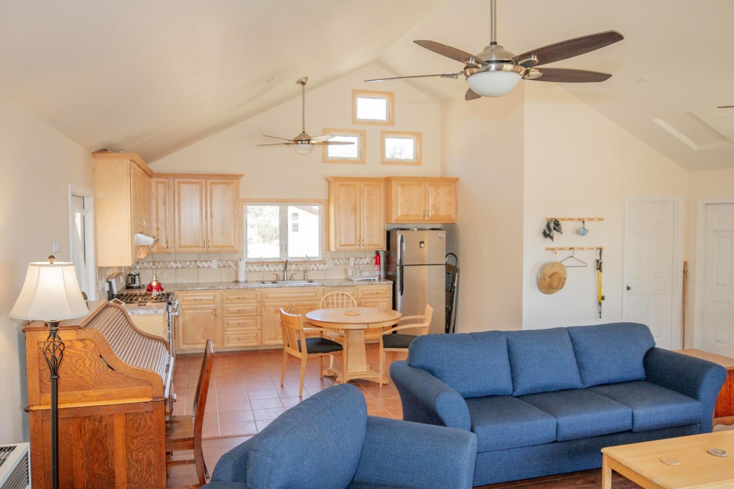 44981 Todd Eymann Road Dunlap, CA 93621 - Photo 6 of 95 a living room with furniture kitchen view and a chandelier