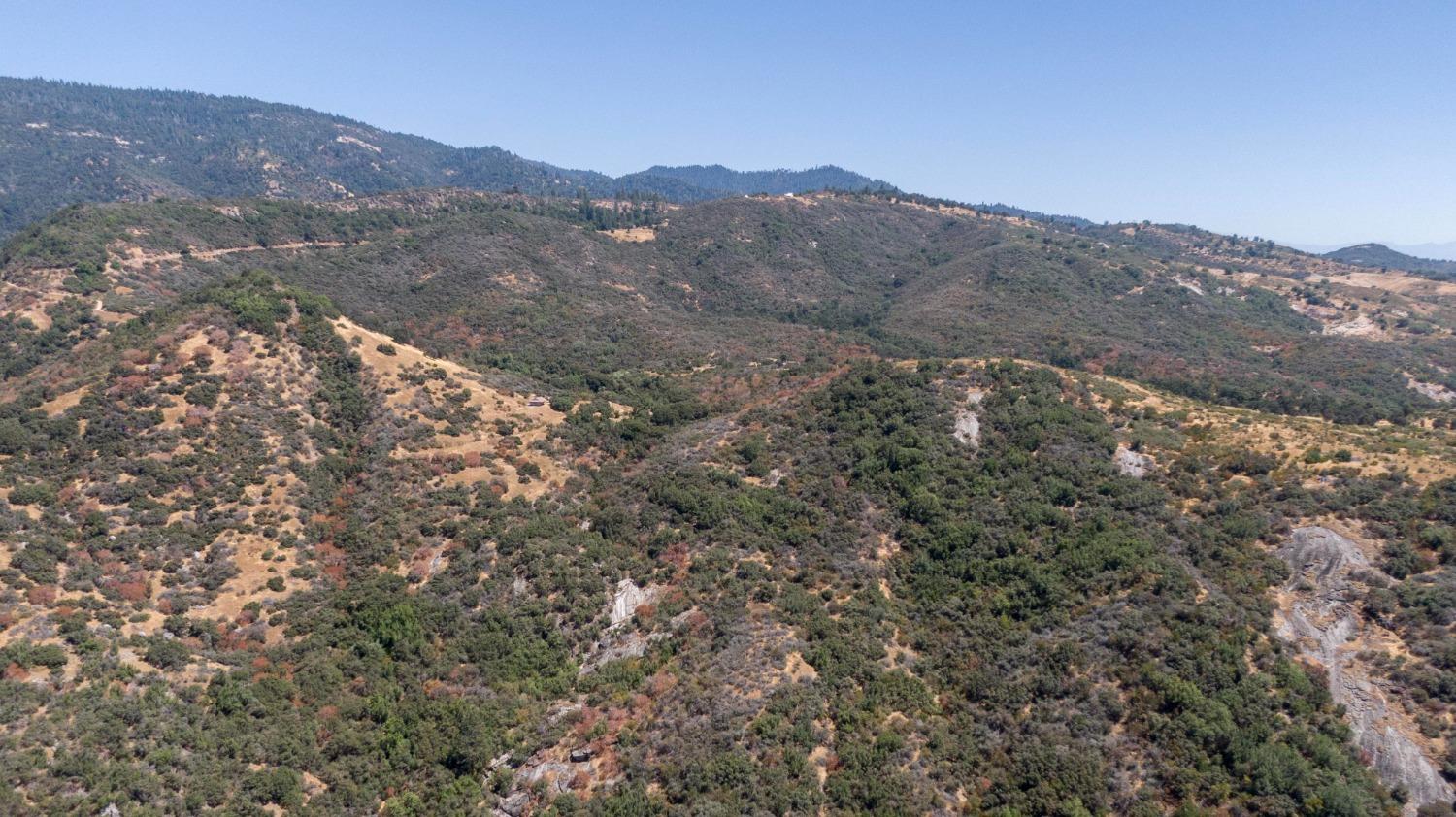 44981 Todd Eymann Road Dunlap, CA 93621 - Photo 73 of 95 a view of a dry yard with mountains in the background