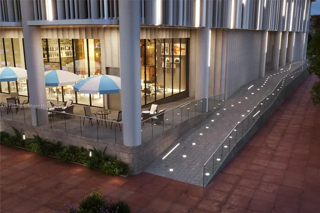 a view of a patio with table and chairs potted plants with wooden floor and fence