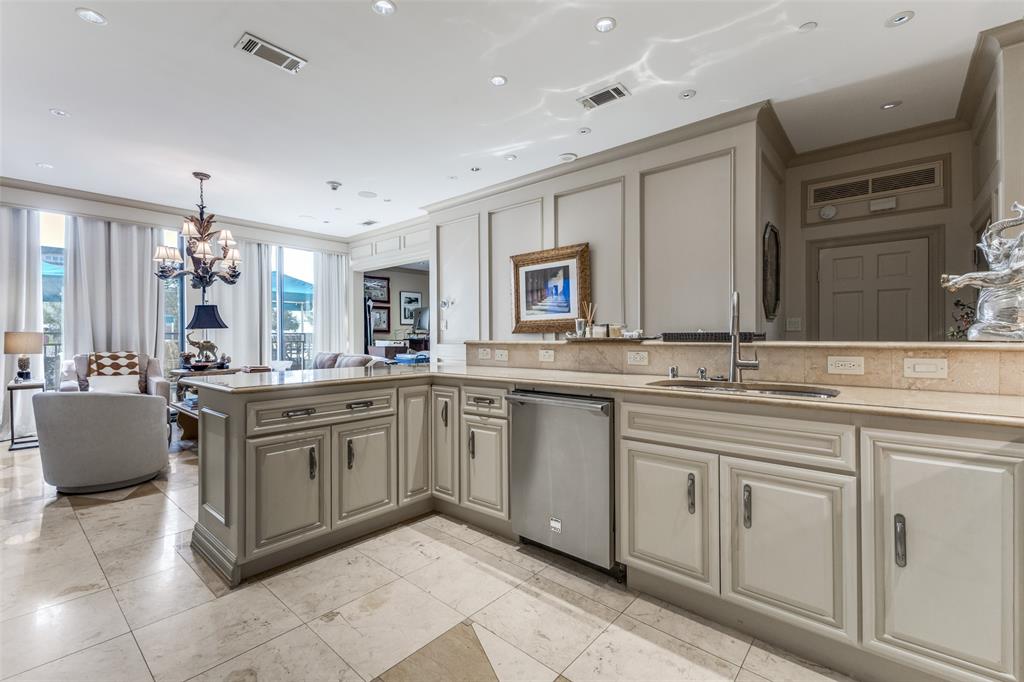 5909 Luther Lane, Unit 707 Dallas, TX 75225 - Photo 13 of 14 a spacious bathroom with a granite countertop sink and a mirror