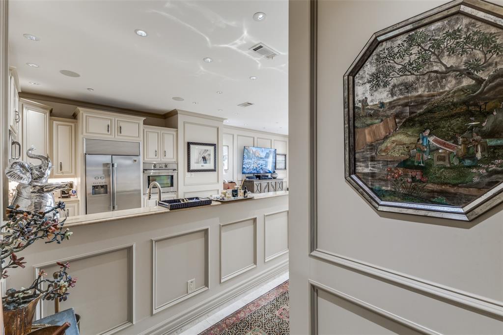 5909 Luther Lane, Unit 707 Dallas, TX 75225 - Photo 5 of 14 a kitchen with stainless steel appliances granite countertop a refrigerator and a stove