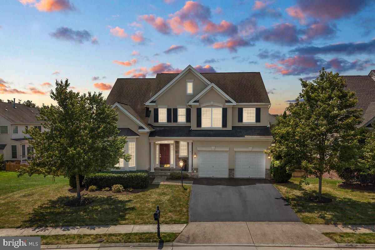 42819 Conquest Circle Ashburn, VA 20148 - Photo 2 of 55 a front view of a house with a garden