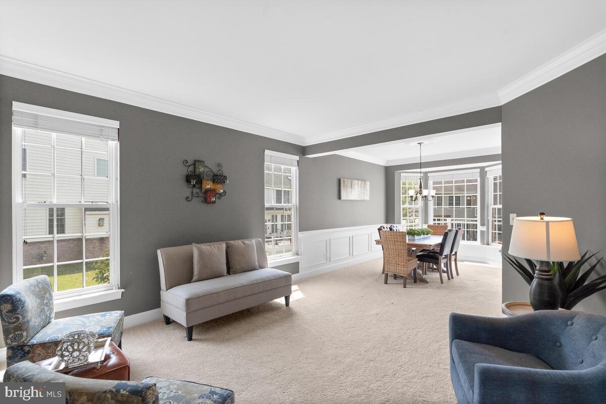 42819 Conquest Circle Ashburn, VA 20148 - Photo 12 of 55 a living room with furniture and a large window