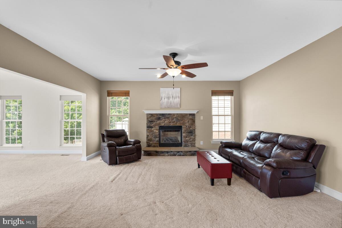 42819 Conquest Circle Ashburn, VA 20148 - Photo 23 of 55 a living room with furniture fireplace and window