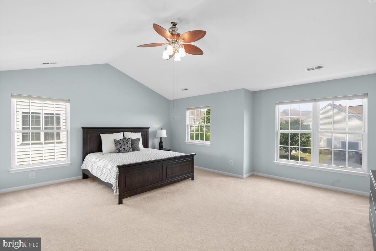42819 Conquest Circle Ashburn, VA 20148 - Photo 30 of 55 a spacious bedroom with a large bed and a window