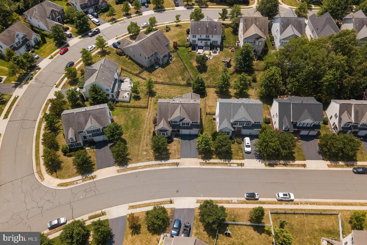 42819 Conquest Circle Ashburn, VA 20148 - Photo 5 of 55 an aerial view of a house with a swimming pool