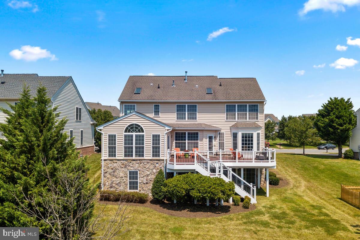 42819 Conquest Circle Ashburn, VA 20148 - Photo 47 of 55 a front view of a house with a yard