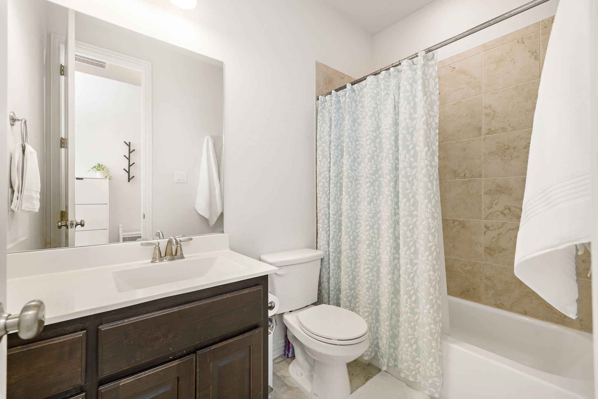 4201 Vespa Cove Leander, TX 78641 - Photo 16 of 29 a bathroom with a sink a toilet and a mirror