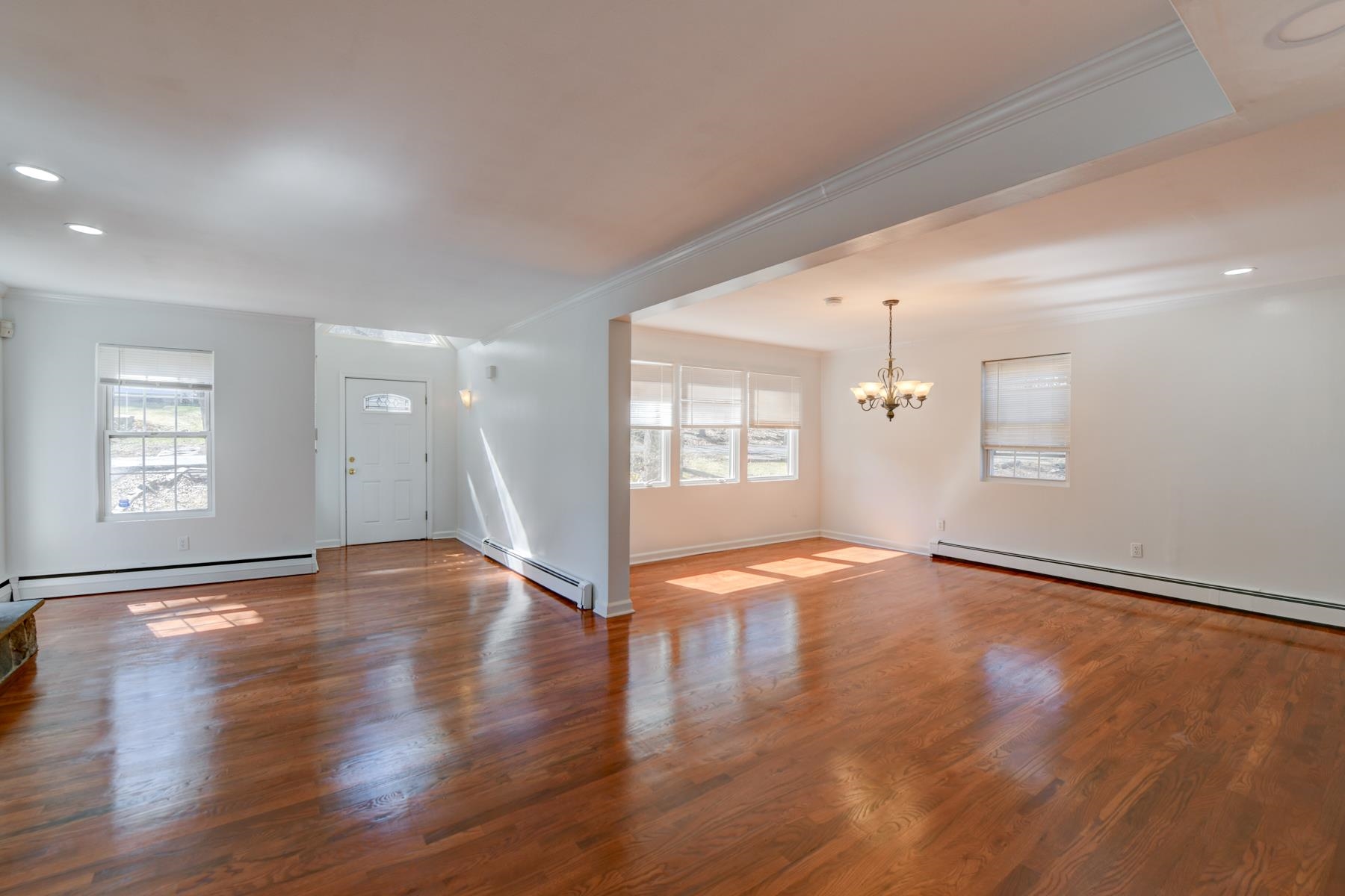 10 Toye Street Randolph, NJ 07869 - Photo 19 of 48 an empty room with wooden floor and windows