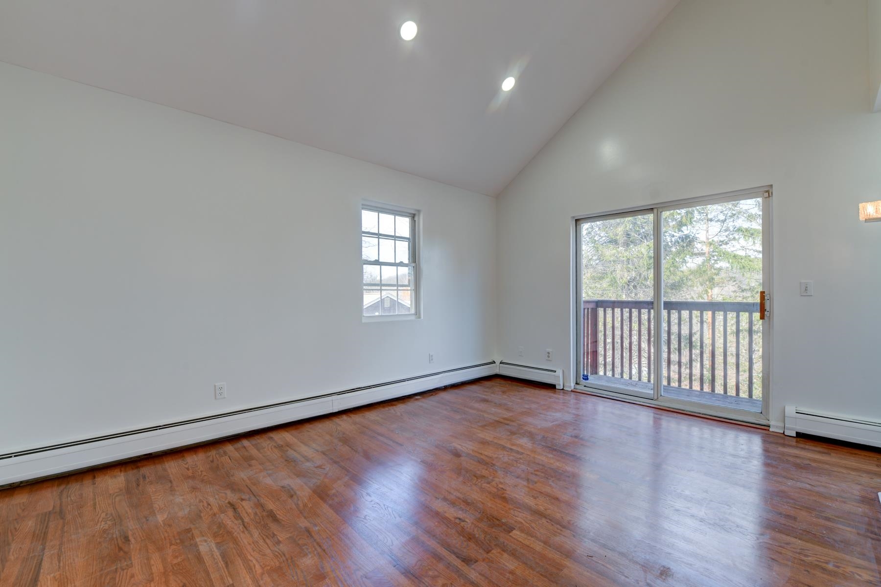10 Toye Street Randolph, NJ 07869 - Photo 20 of 48 an empty room with wooden floor and windows