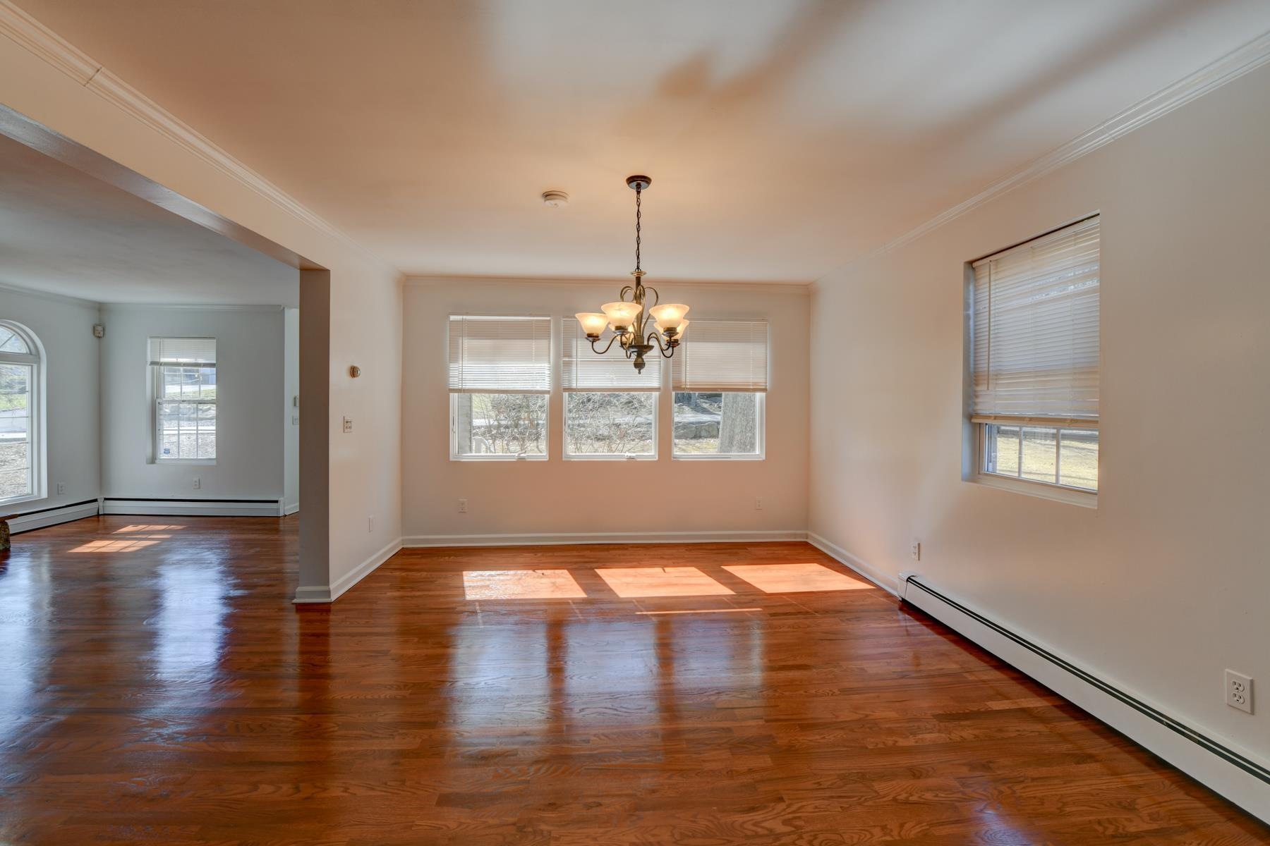 10 Toye Street Randolph, NJ 07869 - Photo 27 of 48 a view of an empty room with window and wooden floor