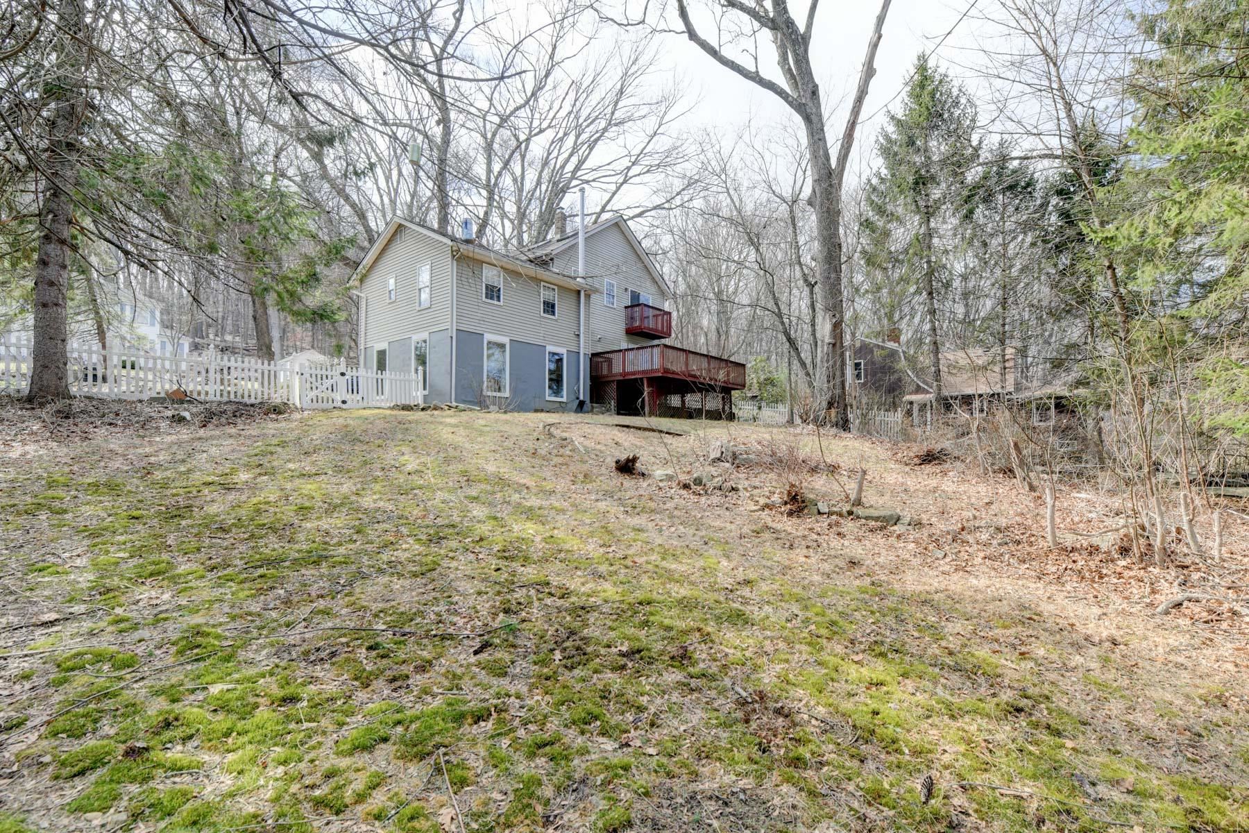 10 Toye Street Randolph, NJ 07869 - Photo 3 of 48 a front view of a house with a yard covered in snow