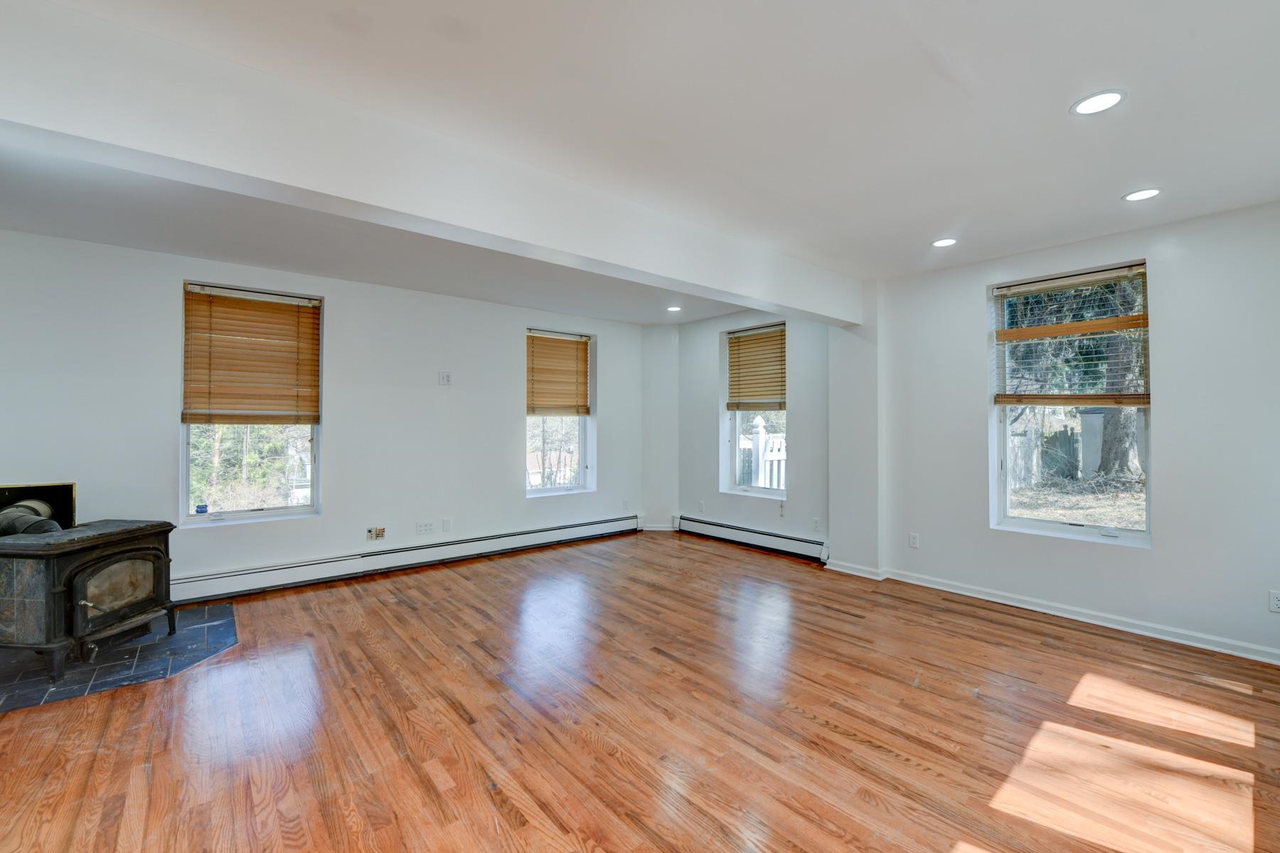 10 Toye Street Randolph, NJ 07869 - Photo 35 of 48 a view of an empty room with wooden floor and a window