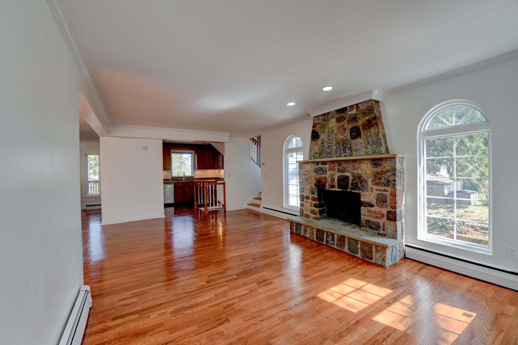 10 Toye Street Randolph, NJ 07869 - Photo 8 of 48 a living room with furniture a fireplace and wooden floor