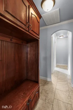 a view of an empty room and wooden floor