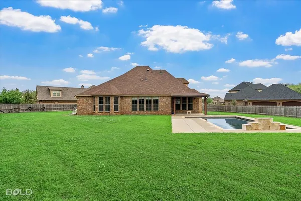 a view of a house with a big yard