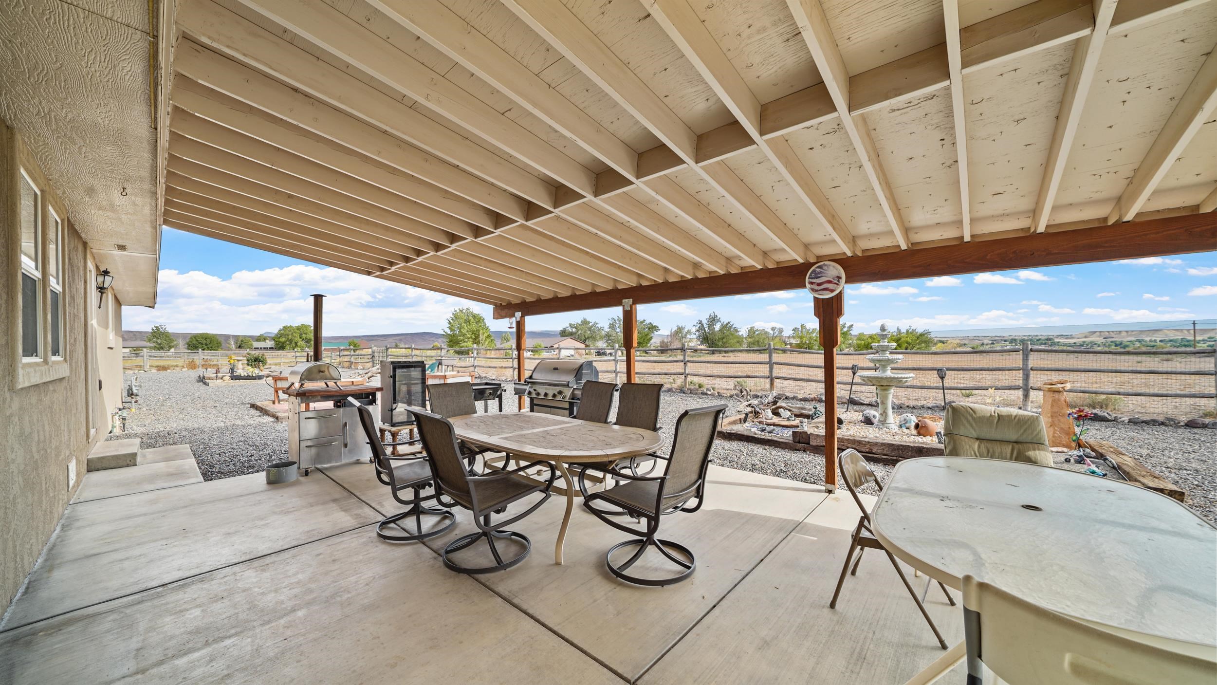 20786 Iris Road Austin, CO 81410 - Photo 28 of 38 a view of a patio with a table and chairs