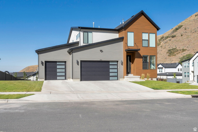 1711 West Canyon Rim Road North Lehi, UT 84048 - Photo 1 of 31 Contemporary architectural style featuring wood-look and gray siding
