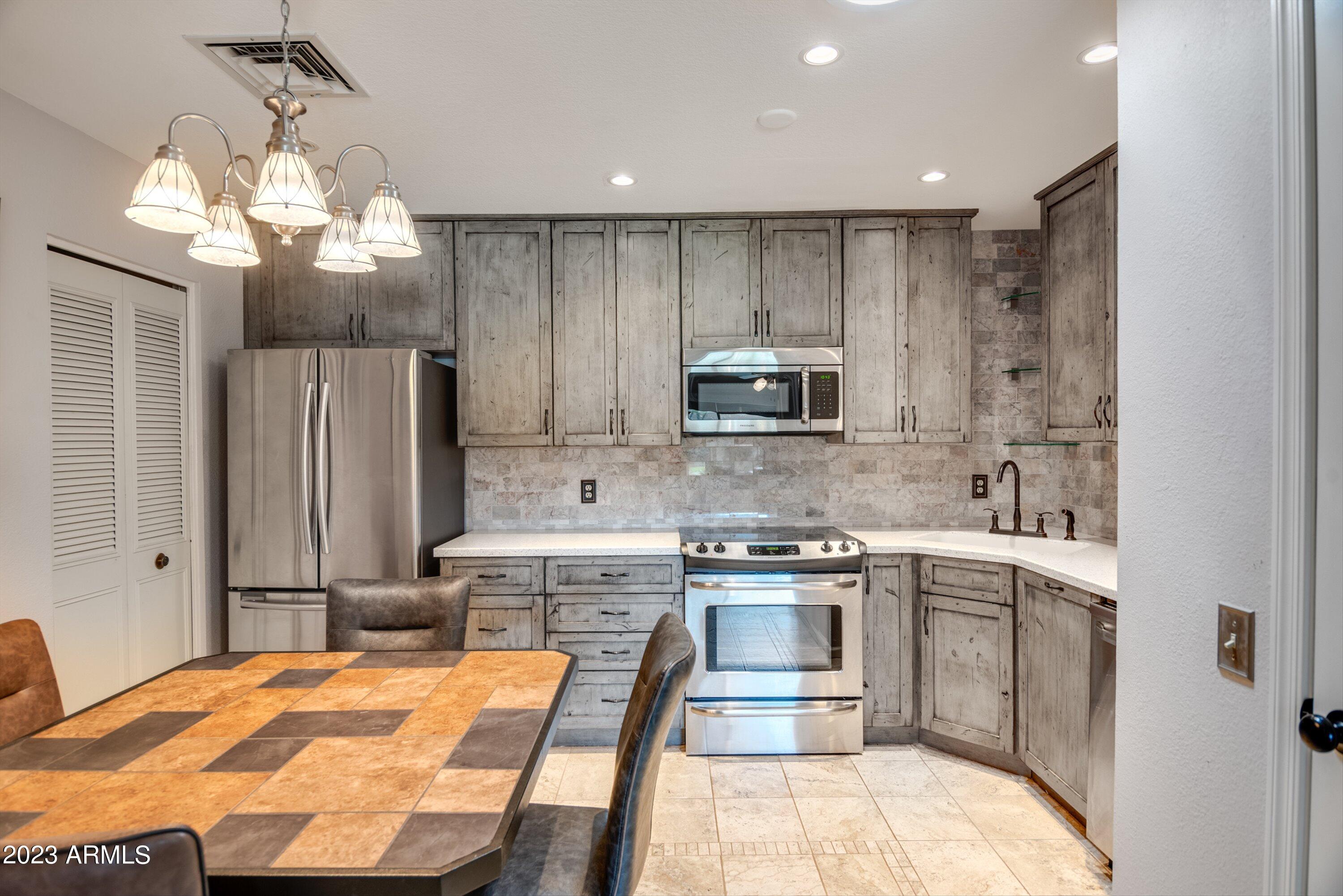 14300 West Bell Road, Unit 122 Surprise, AZ 85374 - Photo 11 of 35 Kitchen to Laundry