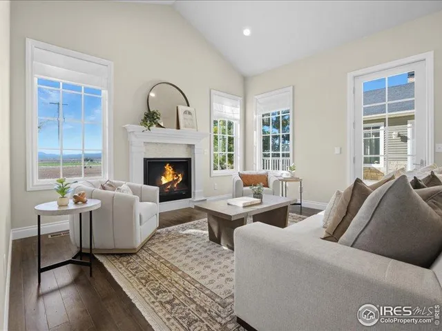 a bathroom with a tub a window and a shower