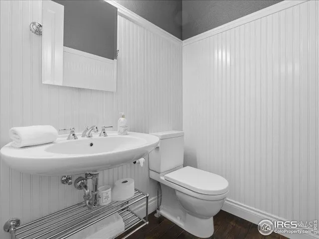 an aerial view of a house with a garden and lake view