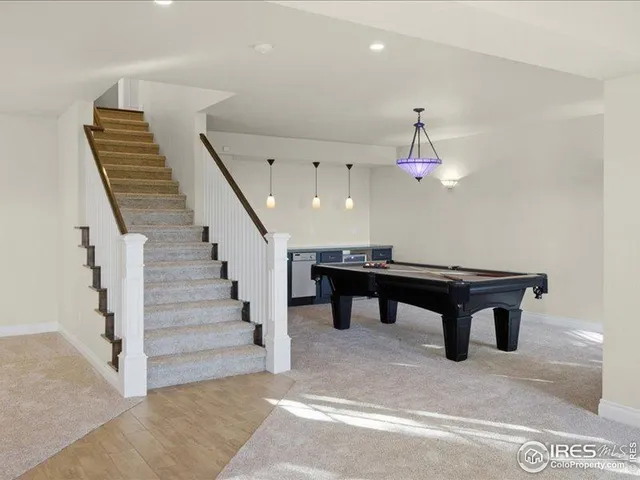 an aerial view of a house with a garden and sitting area