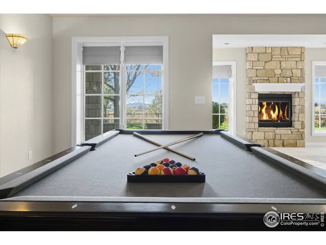 a aerial view of a house with a yard and potted plants