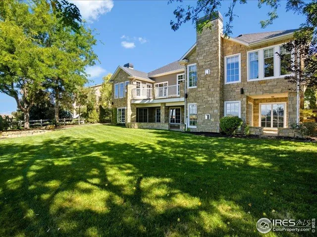 a balcony with two couches and painted walls