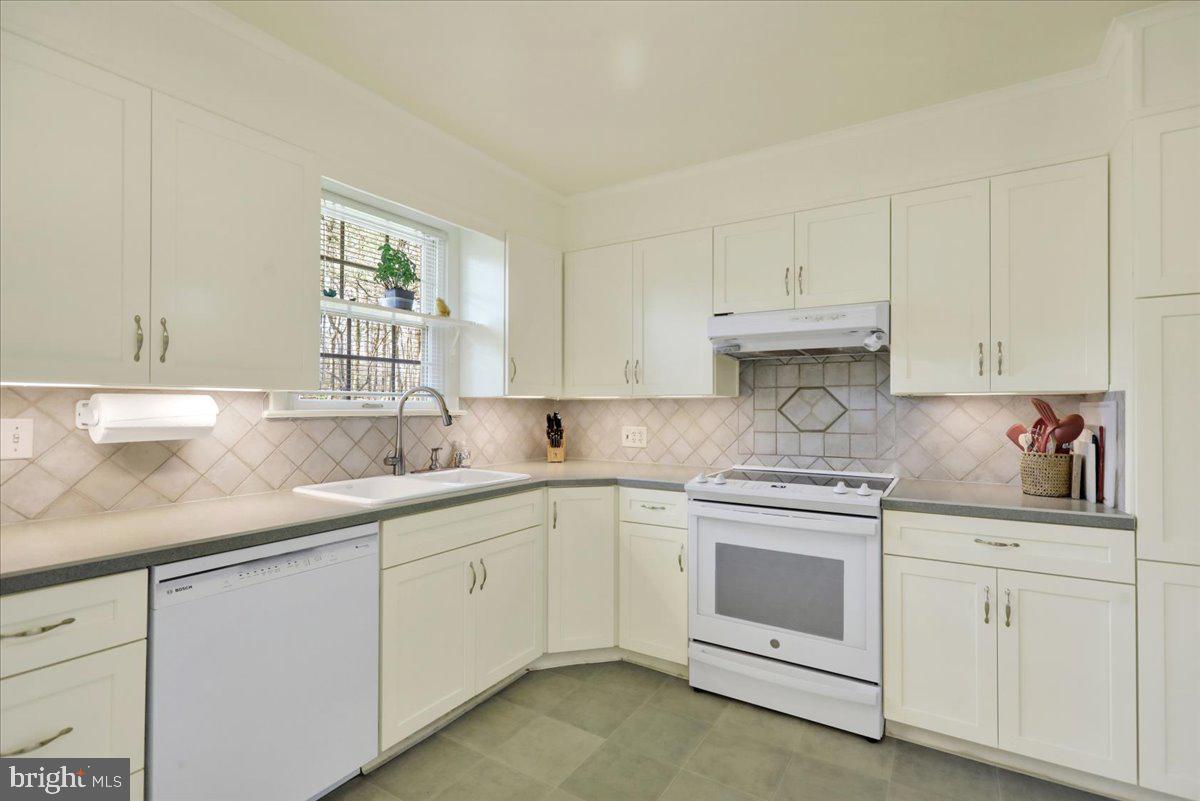 250 Clearfield Road New Providence, PA 17560 - Photo 15 of 35 a kitchen with white cabinets sink and appliances
