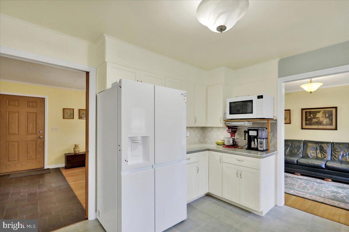 250 Clearfield Road New Providence, PA 17560 - Photo 17 of 35 a kitchen with a refrigerator and a stove top oven