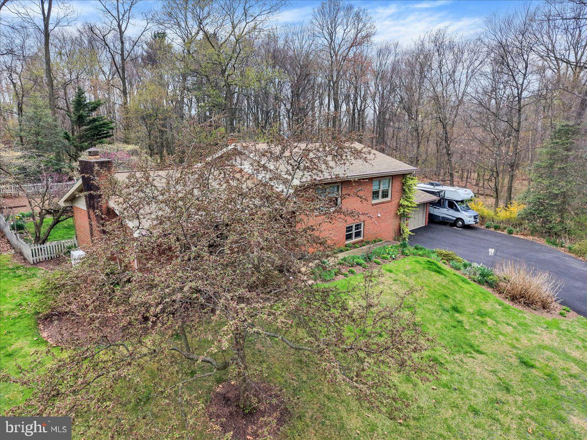 250 Clearfield Road New Providence, PA 17560 - Photo 2 of 35 a view of a house with a yard and sitting area