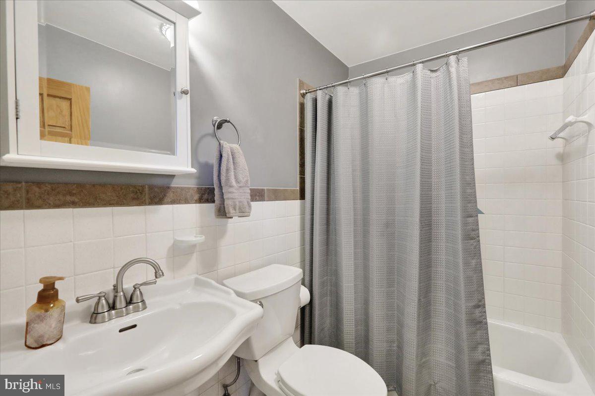 250 Clearfield Road New Providence, PA 17560 - Photo 21 of 35 a bathroom with a sink mirror and toilet