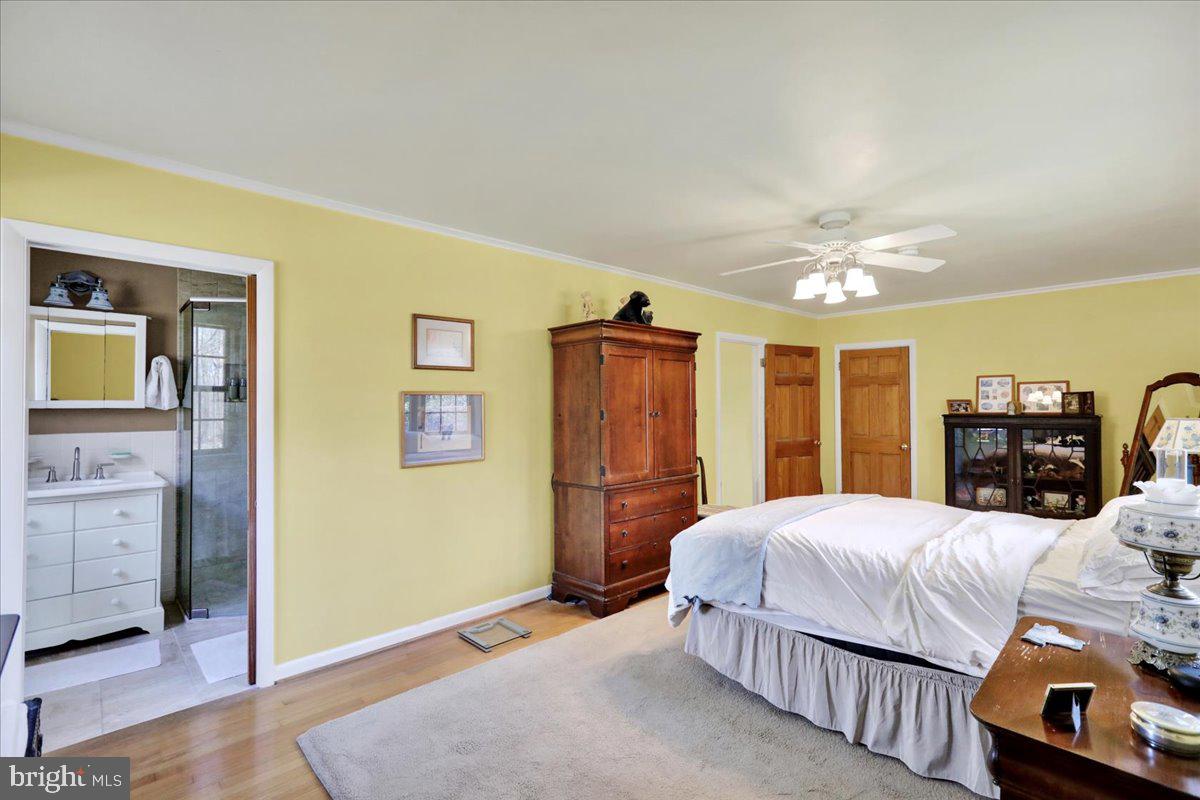 250 Clearfield Road New Providence, PA 17560 - Photo 23 of 35 a bedroom with a bed and wooden floor