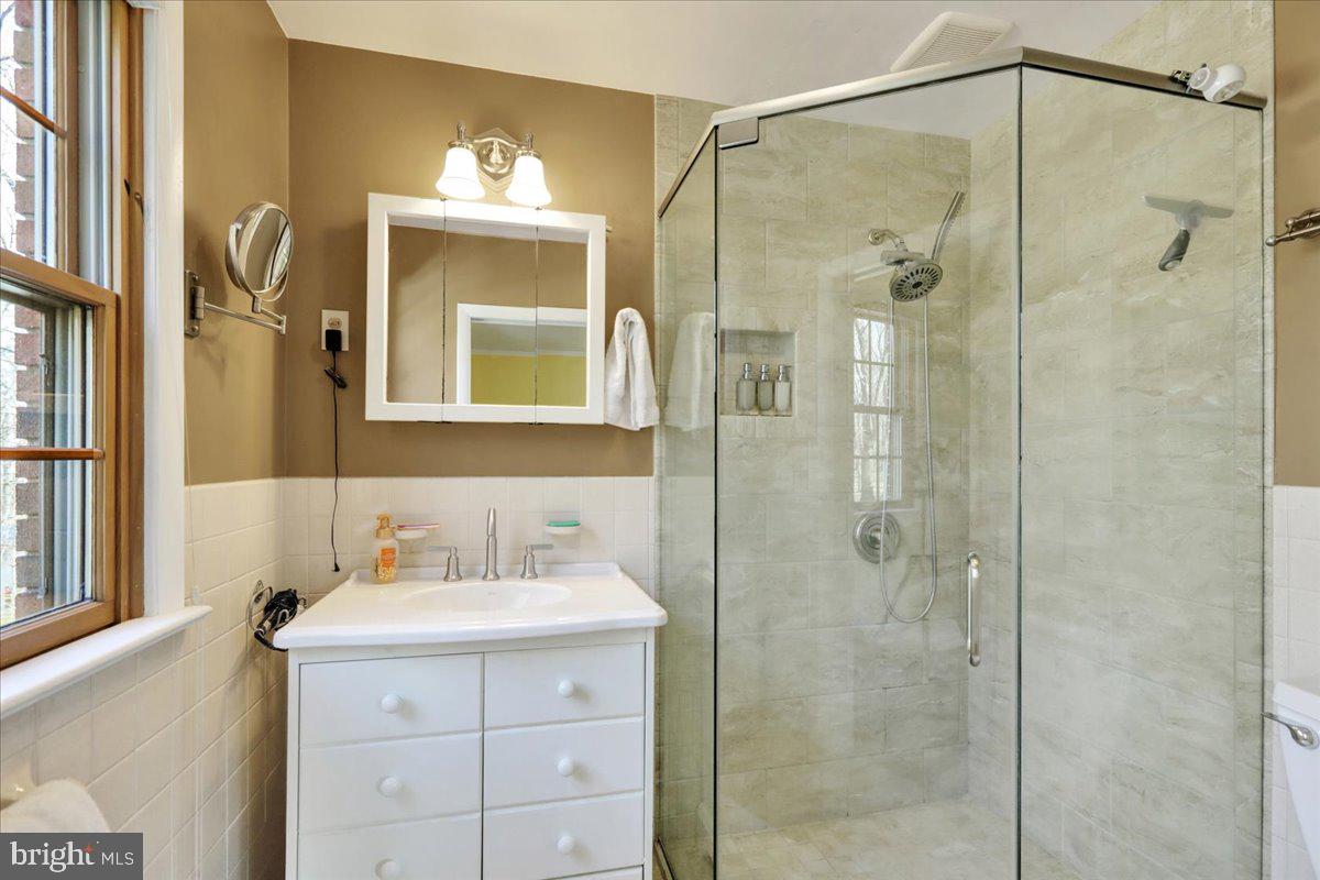 250 Clearfield Road New Providence, PA 17560 - Photo 24 of 35 a bathroom with a sink mirror and a shower