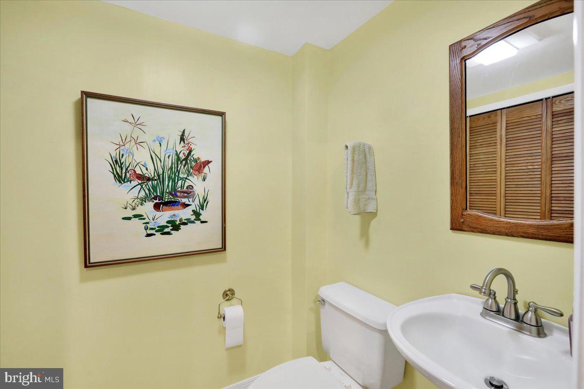 250 Clearfield Road New Providence, PA 17560 - Photo 31 of 35 a bathroom with a sink mirror and toilet
