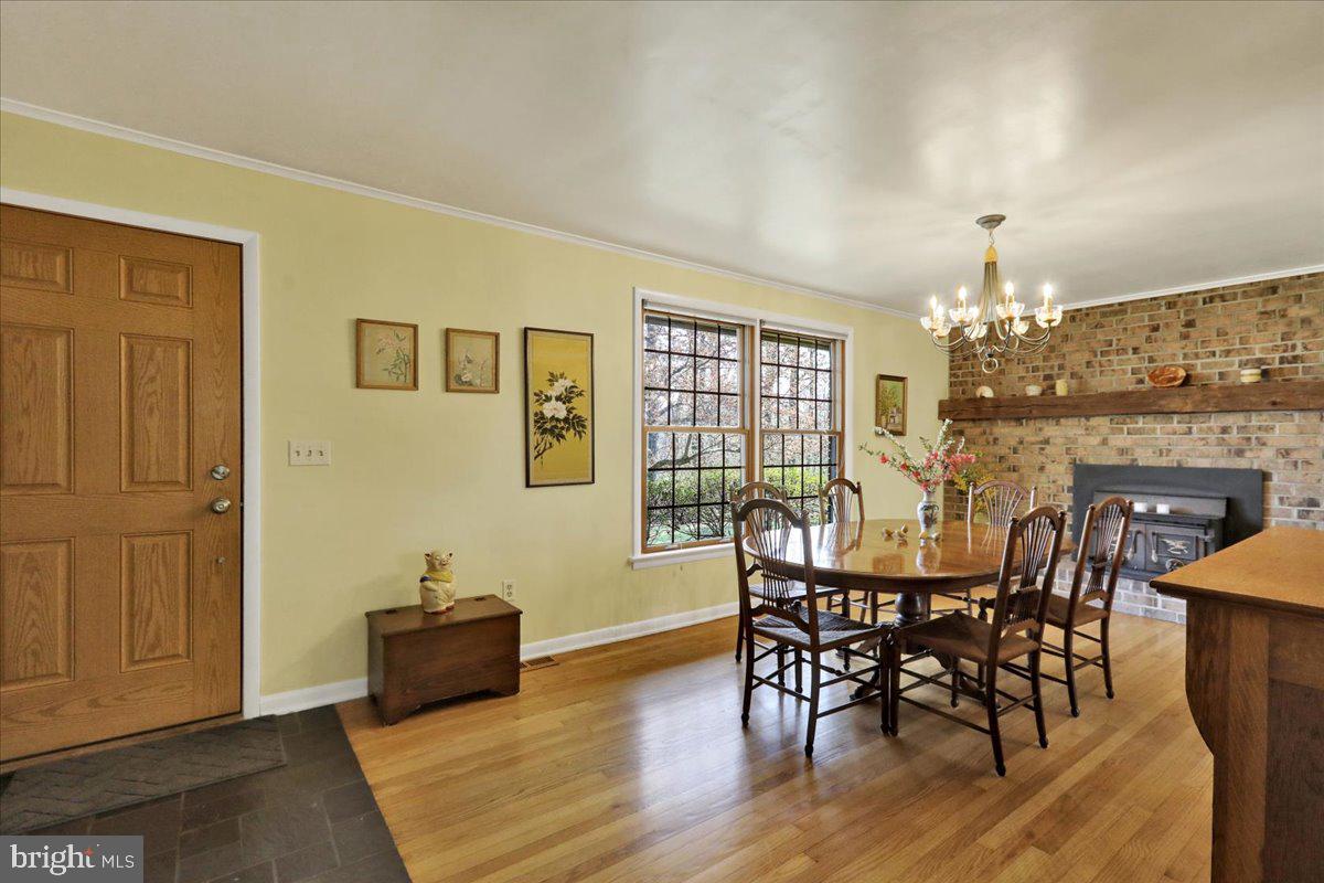 250 Clearfield Road New Providence, PA 17560 - Photo 10 of 35 a view of a dining room with furniture window and wooden floor