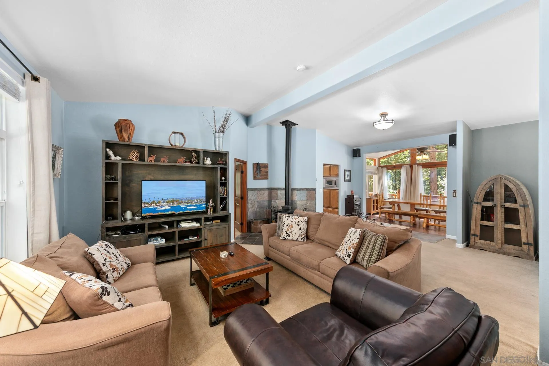 24655 Upper Rim Rock Road Idyllwild, CA 92549 - Photo 26 of 48 a living room with furniture and a flat screen tv